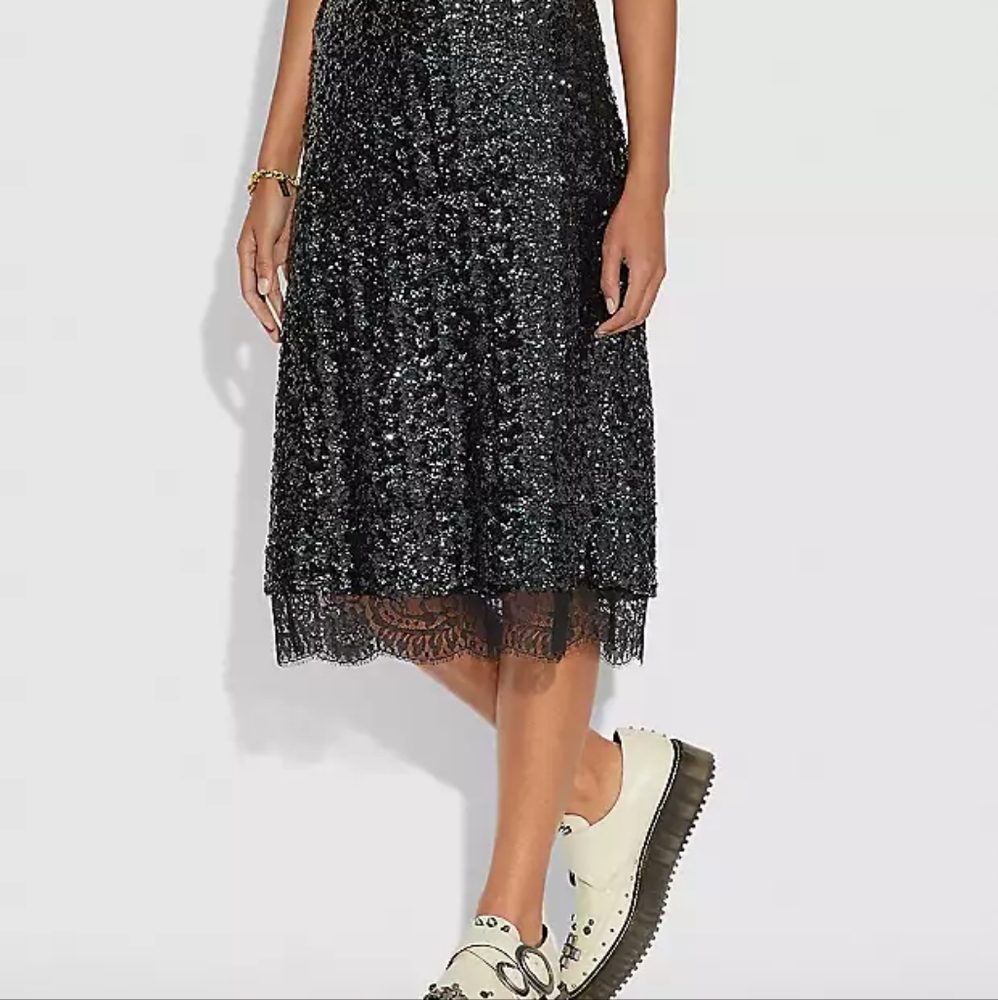 NWT sequin COACH skirt. Black iridescent sequin with lace trim, size 6.